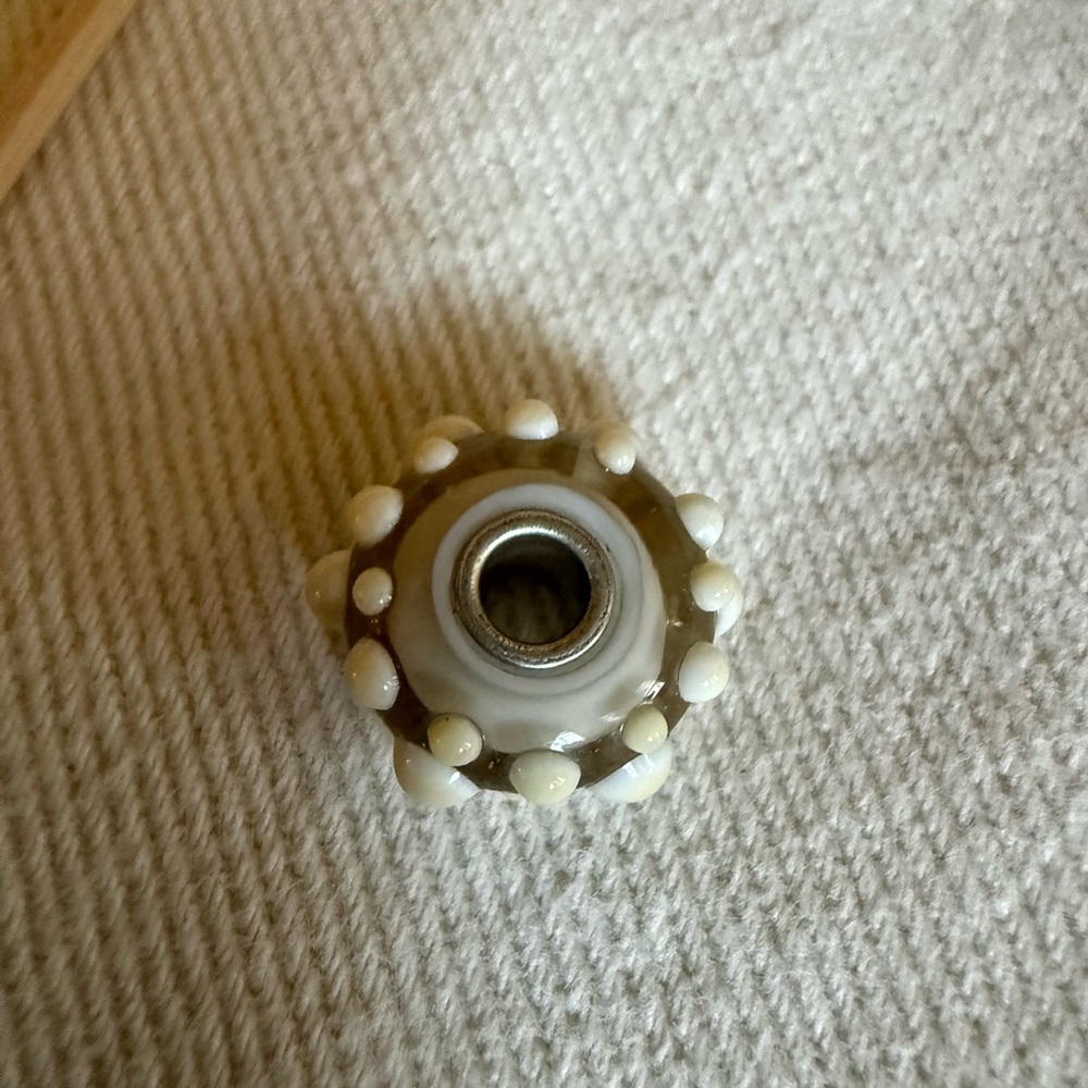 Trollbead cream colored bead with accents
